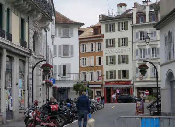 Beautiful waterfront walking path with flower beds, giant fork sculpture on the water, food museum with interesting garden, and square with historic buildings and cafes.