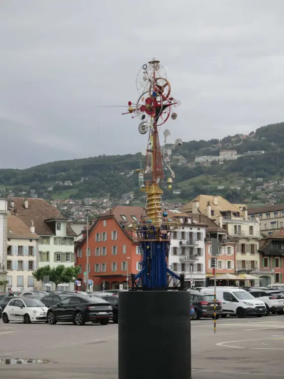 Beautiful waterfront walking path with flower beds, giant fork sculpture on the water, food museum with interesting garden, and square with historic buildings and cafes.