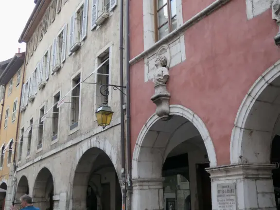 Our favorite bakery, and a street with colorful buildings and archways, lined with brasseries.