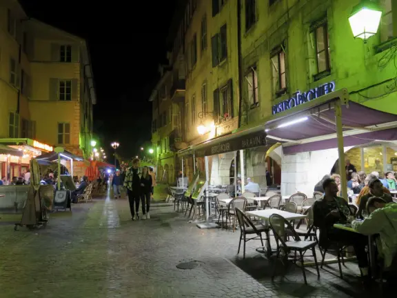 Our favorite bakery, and a street with colorful buildings and archways, lined with brasseries.