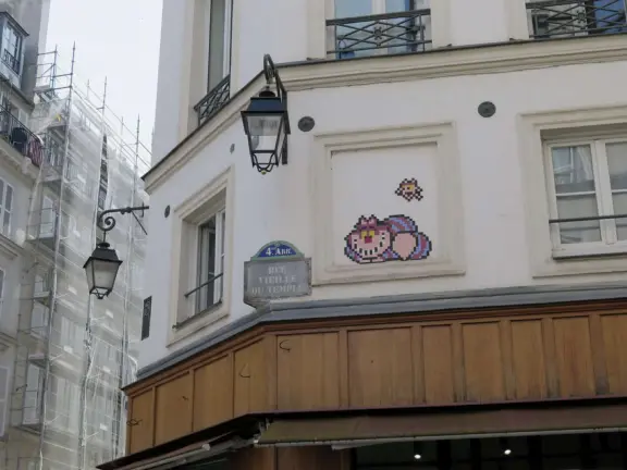 An ancient, pretty street with upscale shops in attractive storefronts. It leads south to the Seine River.