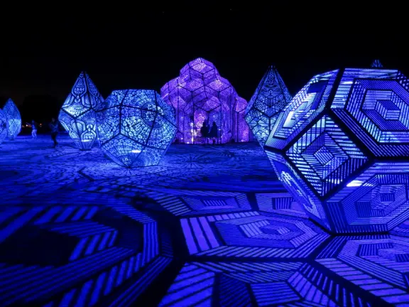 A wonderful exhibit on acres of undulating hills, with a field of lights resembling a flower field, and metal sculptures making patterns of light.