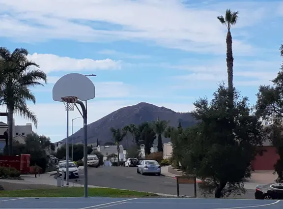 Basketball court at Stoneridge Park and view of Cerro San Luis or M mountain. 