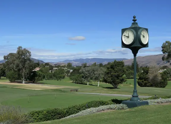 A pleasant walk past pretty houses, varied trees, and sweeping mountain views.