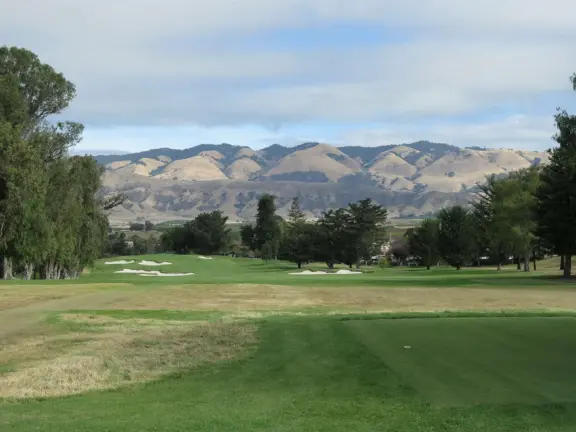 A pleasant walk past pretty houses, varied trees, and sweeping mountain views.