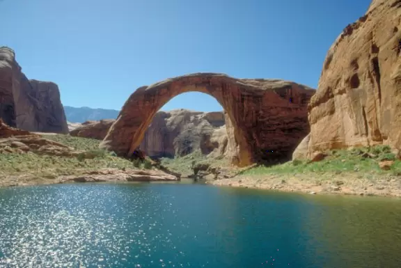 Magnificent canyon filled with water where you can swim in glassy blue-green waters and look up at the red rock above!