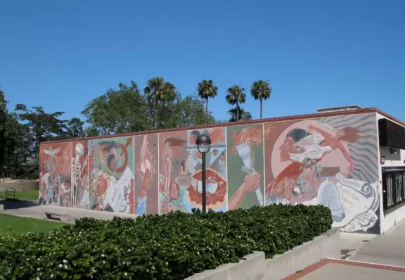 A huge green lawn looking out over the bright blue ocean and Leadbetter Beach.
