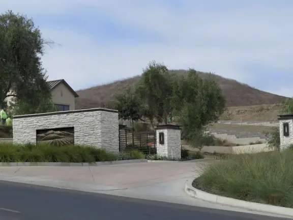 A pleasant walk past pretty houses, varied trees, and sweeping mountain views.