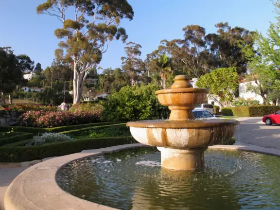 Picture-perfect rose gardens, below a grassy green hill across the street from where the Santa Barbara Mission stands.