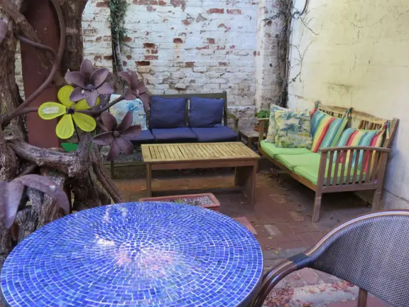 A main street of late 19th century storefronts, popular cafes, and a hip college scene. Recently, suffering an epidemic of homelessness relating to mental health problems.