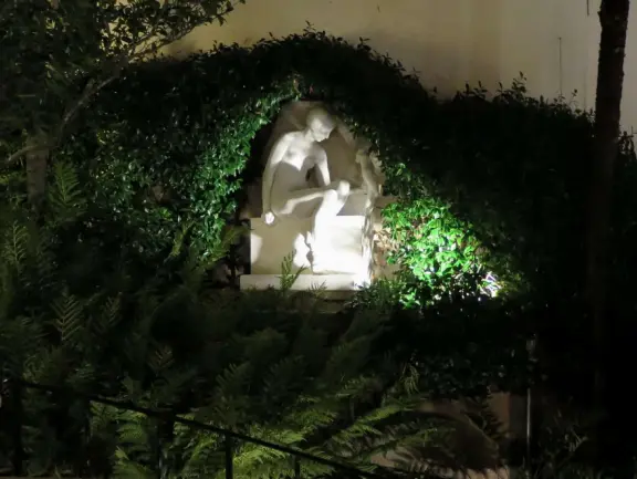 Sculpture grotto lit up at night. 