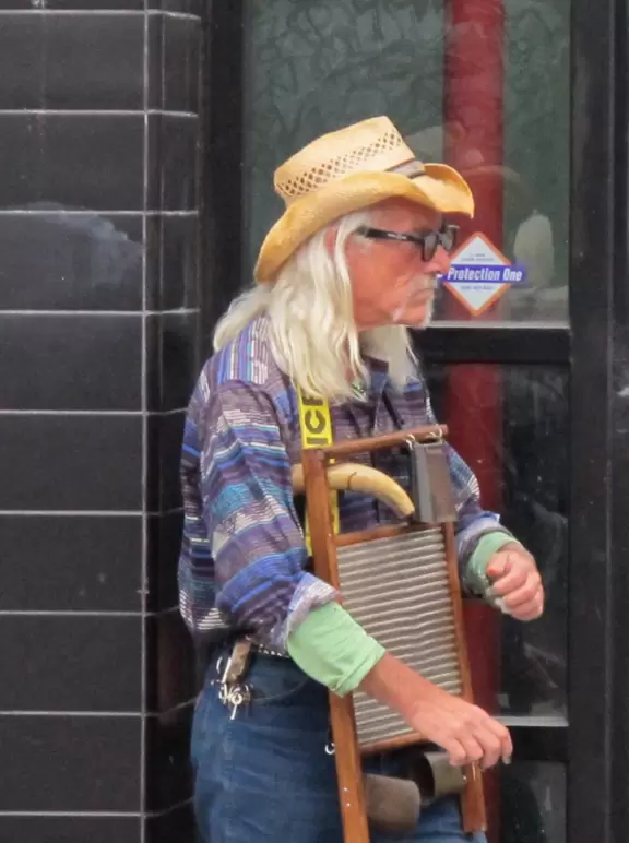 Wild street of sights and smells, ironically labeled a "Drug Free Zone."