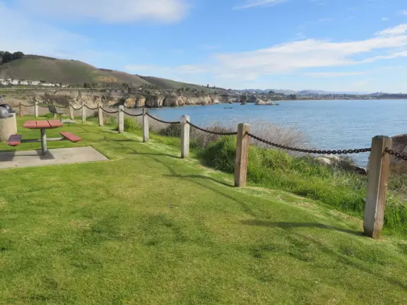 A great place to picnic or marry, with sea caves and jutting sea rocks below cliffs of hanging flowers.