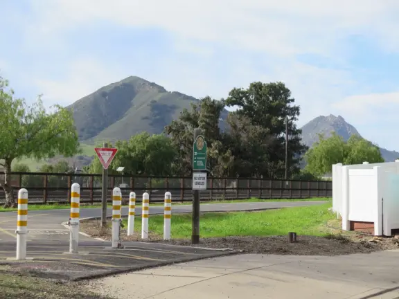 Bike path with views of hills all around, and pretty neighborhood nearby.