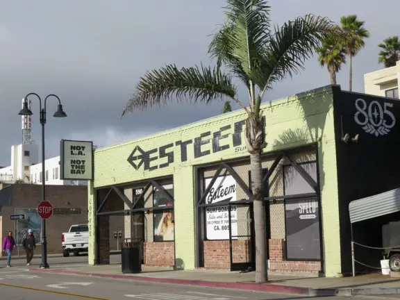 Gorgeous spot with wide pier, surfers carving the waves, whale playground, wide open attractive plaza, Pismo Beach selfie sign, and wooden promenade with views of the hills and sea.