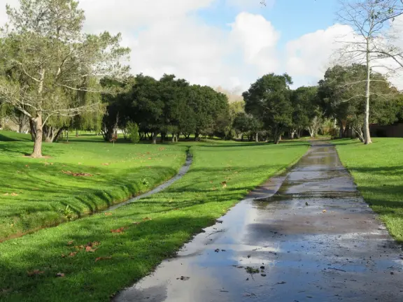 A lush park with rolling hills to run on, one-mile loop walking path, and basketball and sand volleyball courts. Currently has a crime problem.
