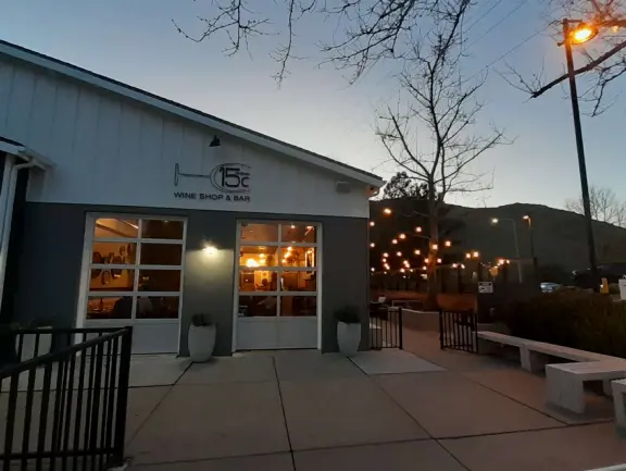 Trendy area with coffee shop, beer garden, wine bars, and cider bar, in industrial-style architecture with murals.