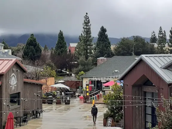 Attractive public market with sunny outdoor space and cute balcony upstairs.