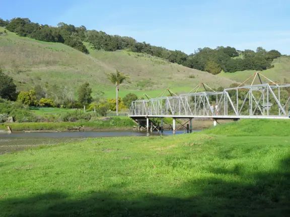 Wide partially shady path that leads through oak forest, past a market, and a Secret Garden with live music, to Avila Beach.