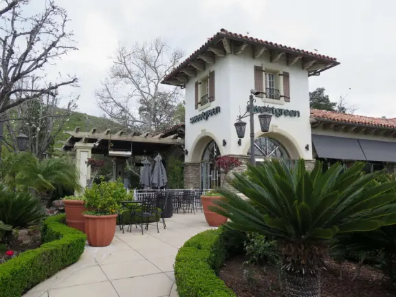 Beautiful mall with bell tower, stained glass lamps, fountains, murals, flowers, sculptures of children, mega bookstore, cinemas, and restaurants.