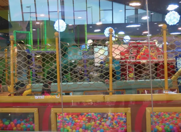 Indoor mall with kids mini train in the center, Target, large movie theater, gourmet food court, and Sanrio store!