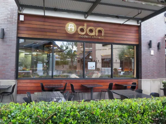 Modern outdoor mall with many places to eat, and nice decor.