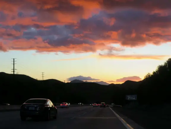 A shopping plaza with sidewalks cafes and shops that would look like Europe if it weren't so new!