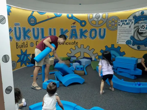 Like a children's museum, with lots of fun hands-on activities and colorful rooms, but plenty of interesting information for adults to read too.