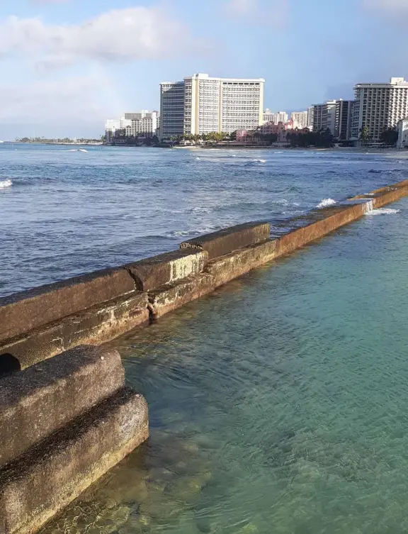 A rock wall protects this area of Waikiki Beach from waves, making it a swimming pool right there at the beach! Also called Kuhio Beach or Kuhio Ponds. Near Waikiki Wall.