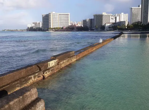 A rock wall protects this area of Waikiki Beach from waves, making it a swimming pool right there at the beach! Also called Kuhio Beach or Kuhio Ponds. Near Waikiki Wall.