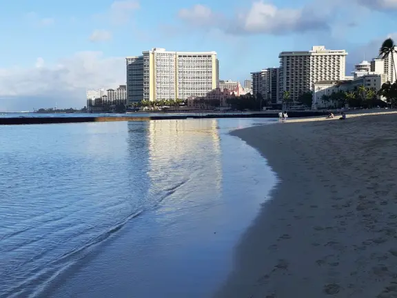 A rock wall protects this area of Waikiki Beach from waves, making it a swimming pool right there at the beach! Also called Kuhio Beach or Kuhio Ponds. Near Waikiki Wall.