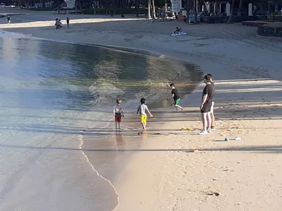 A rock wall protects this area of Waikiki Beach from waves, making it a swimming pool right there at the beach! Also called Kuhio Beach or Kuhio Ponds. Near Waikiki Wall.