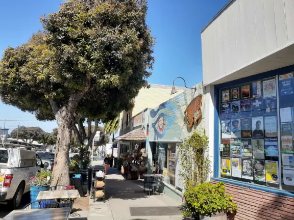A lovely, hilly street with ocean views, lined with cute cafes.