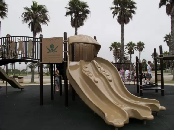 Beautiful dunes, cold breezes, hundreds of palms, a bike path, and a huge pirate playground.