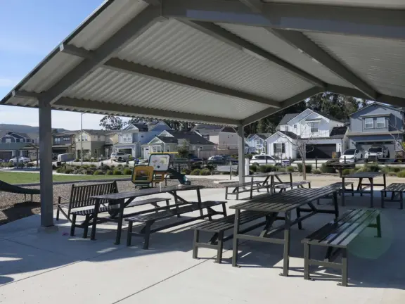 A colorful, fun playground with huge twisty slide, three-level climby, tractor, baby swings, basketball court, and giant lawn. Also called San Luis Ranch.&nbsp;