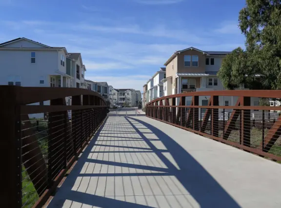 Lovely path beside a eucalyptus forest, on both sides of the creek, with workout stations, in a residential neighborhood. You can walk two miles total. Also called San Luis Ranch.