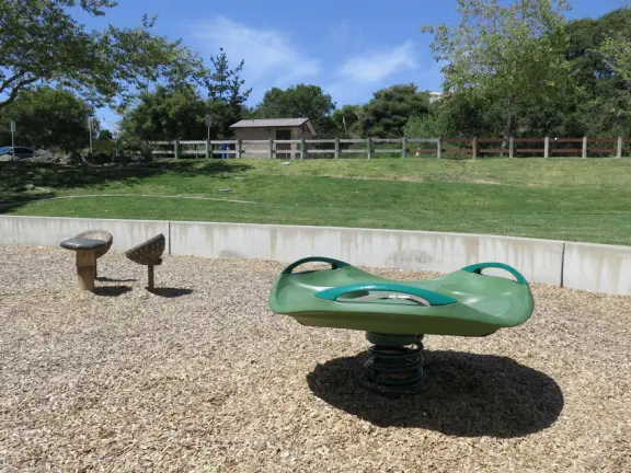Incredible playground in a warm valley, with a pretty trail to walk.