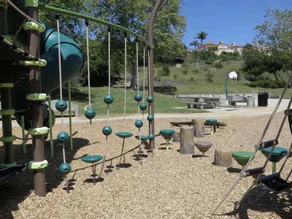 Incredible playground in a warm valley, with a pretty trail to walk.