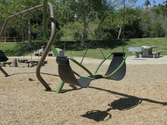 Incredible playground in a warm valley, with a pretty trail to walk.