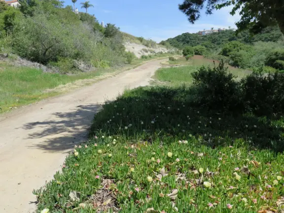 Incredible playground in a warm valley, with a pretty trail to walk.
