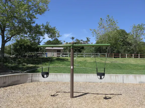 Incredible playground in a warm valley, with a pretty trail to walk.