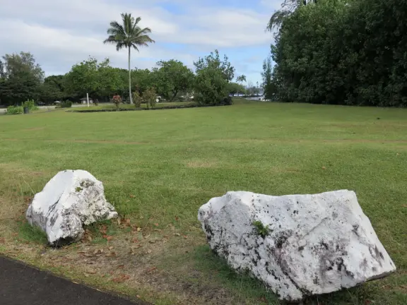 Small park with picnic tables, and views across the water to Reeds Bay Beach Park.