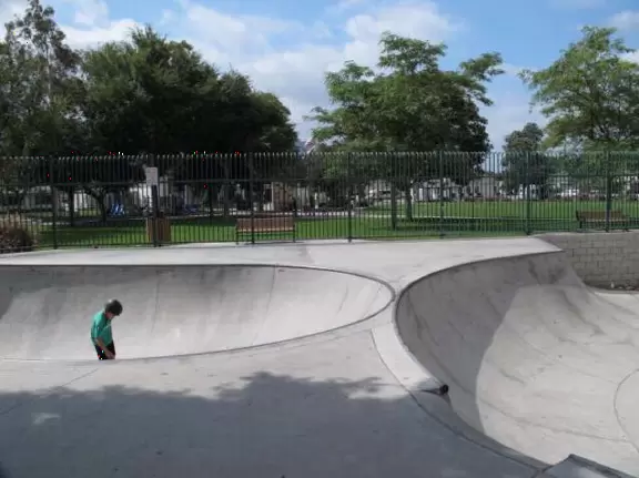 Large open space with views of mountains, toddler playground, and huge skatepark!