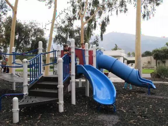 Large open space with views of mountains, toddler playground, and huge skatepark!
