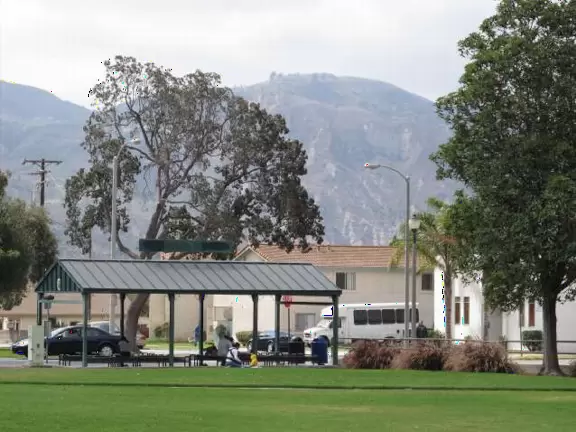 Large open space with views of mountains, toddler playground, and huge skatepark!