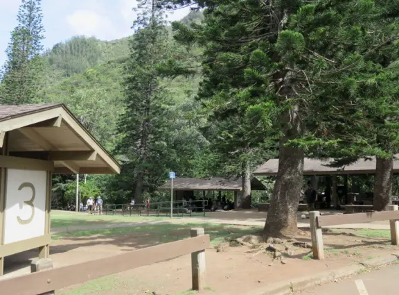 A gorgeous public garden under high mountain ridges, with dwellings representing the many cultures that are found in Maui: Portuguese, Chinese, Japanese, Filipino, Hawaiian, and New England.