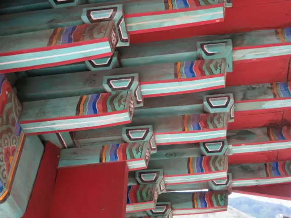 A gorgeous public garden under high mountain ridges, with dwellings representing the many cultures that are found in Maui: Portuguese, Chinese, Japanese, Filipino, Hawaiian, and New England.