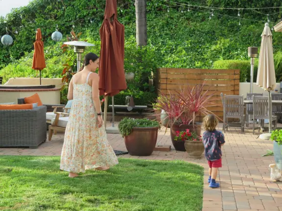 A Carpenter Gothic house with lush gardens and a lake to walk around.