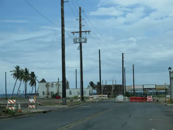 A church that miraculously survived the Lahaina fire. It's garden with mango trees and statues also survived, while beside it is rubble everywhere.