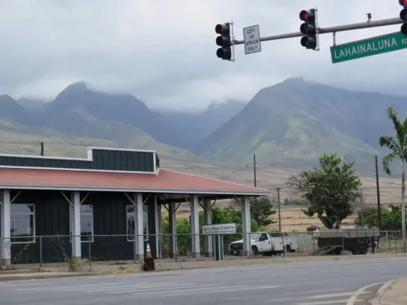 A church that miraculously survived the Lahaina fire. It's garden with mango trees and statues also survived, while beside it is rubble everywhere.